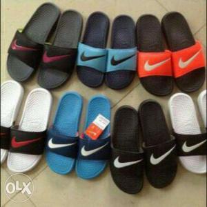 Seven Pairs Of Nike Slide-on Sandals