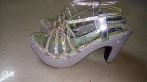 Silver colour sandals.
