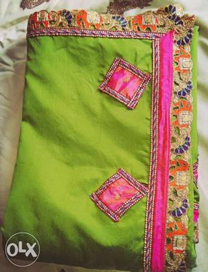 Taffeta silk with green and pink combination.