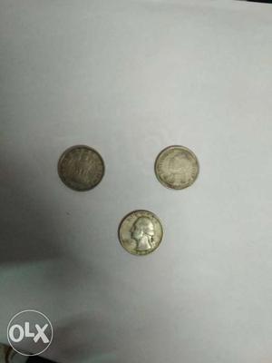 Three Round Silver-colored Coins
