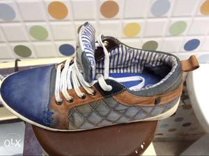 Unpaired Of Blue, Brown, Gray, And White Shoe