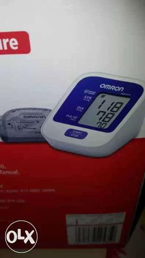 White, And Blue Omron BP Digital Device