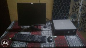 Black Flat Screen Computer Monitor With Mouse, Keyboard And