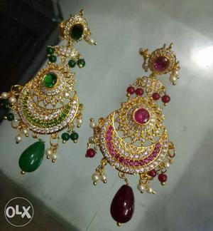 Gold polished earings at low price book now