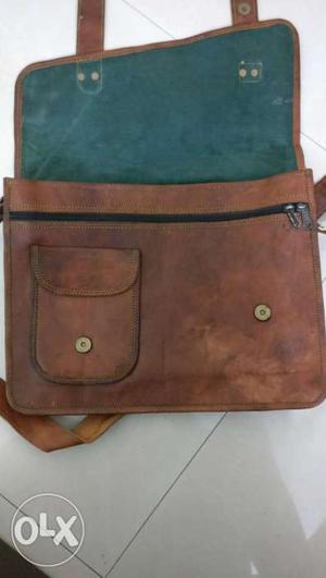 Leather messenger bag with laptop sleeve. New, never used