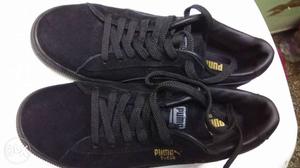 Pair Of Black Puma Sneakers