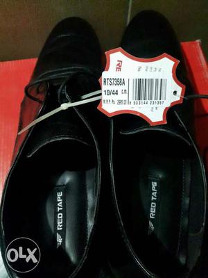 Pair Of Black Red Tape Leather Dress Shoes