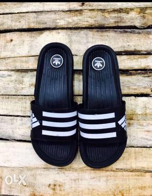Pair Of Black-and-white Adidas Slide Sandals