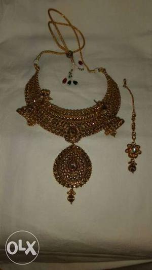 Set of Necklace, Earrings and Mang tikka for sale.