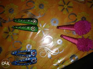 Three Pairs Of Blue, Green, And Pink Hair Clips
