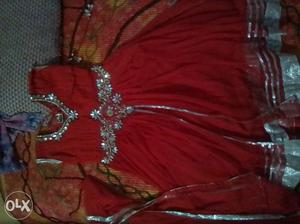 Traditional frock suite in red colour with silver