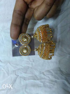 Two Gold-colored Jhumka Earrings