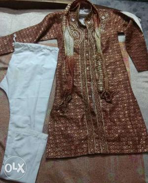 1 time used sherwani. Almost new. For  age