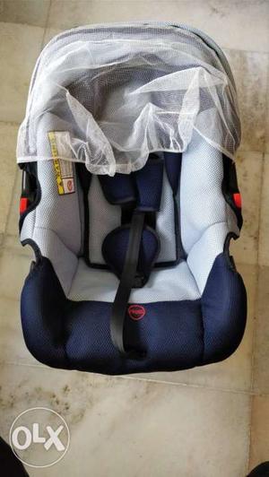 Baby's Blue And Gray Car Seat