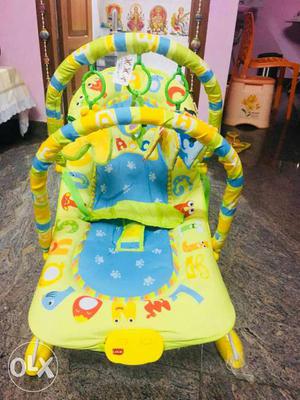 Baby's Yellow, Blue And Red Deluxe Bouncer. Brand new
