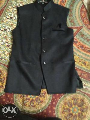 Black sparky waist coat.size large. brand