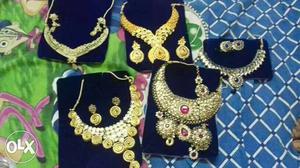 Five Gold-colored Necklace And Earrings Sets