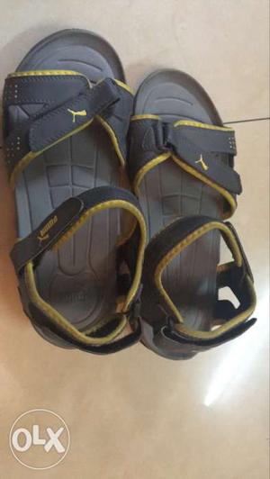 Gray-and-yellow Puma Sandals