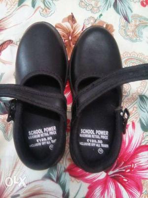 Pair Of Black Leather Mary Jane Flats