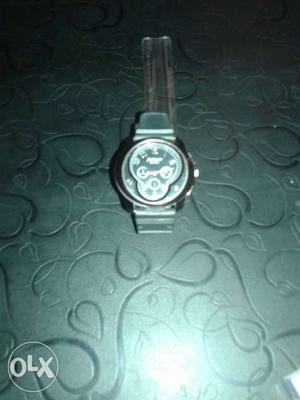 Round Black Faced Chronograph Watch With Black Bezel And