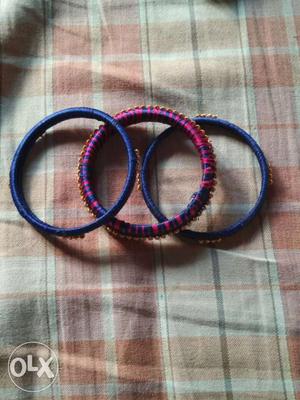 Two Blue And One Purple Bracelets