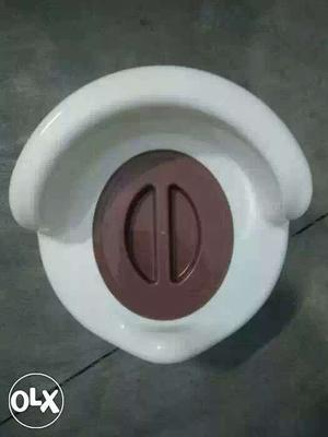 White And Brown Plastic Potty Trainer