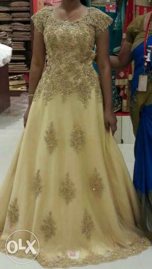 Women's golden Floral Gown..never used..fixed prize
