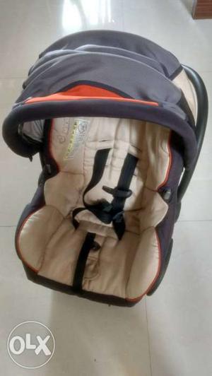 Baby's Brown And Black Car Seat Carrier