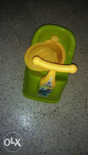 Baby's Green And Yellow Potty Trainer