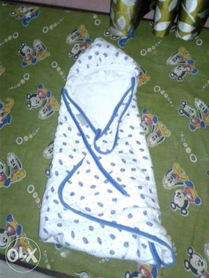 Baby's White And Blue Swaddle