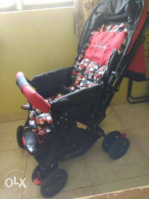 Baby's White, Red, And Black Polka-dot Stroller