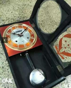 Black And Orange Pendulum Clock