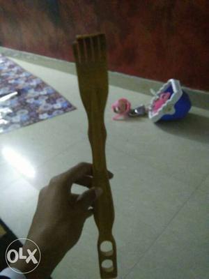 Brown Wooden Back Scratcher