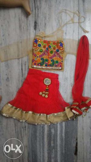 Ethnic dress with gagra, chuni and two tops. Outer top is