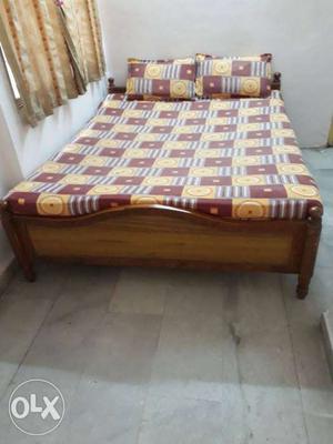 Heavy wooden Double bed with double mattresses.