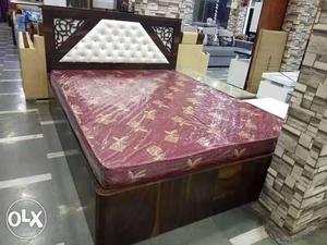 Maroon Floral Mattress And Brown Upholstered Bed Frame