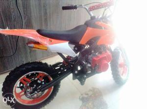 Orange color Dirt Bike for kids self start petrol below 12