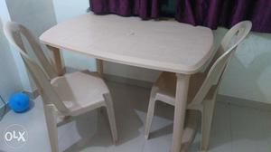 Plastic dining table with 2 chairs, wooden table