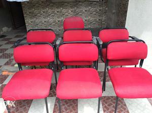 Seven Red Fabric Padded Chairs