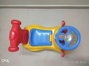 Toddler's Blue, Red, And Yellow Ride-on Car