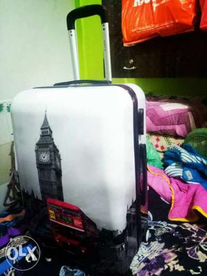 White And Black Luggage Bag