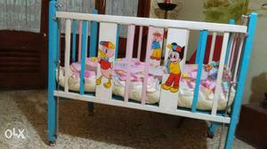 White And Teal Wooden Crib With Mattress