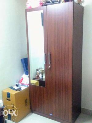 Wooden finish Cupboard with mirror.In new