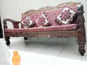 Wooden sofa with the think shown on the sofa and