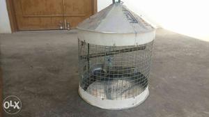 Bird cage in good condition with hanging rod.