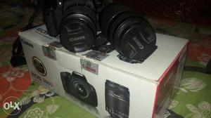 Black Canon DSLR Camera With Telephoto Lens And Box