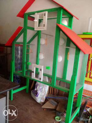 Green, Red, And White Bird Cage