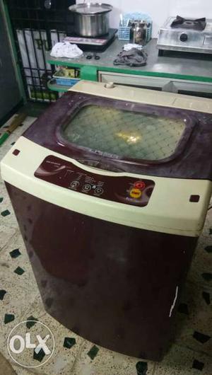 Used Maroon And White Top-load Washing Machine