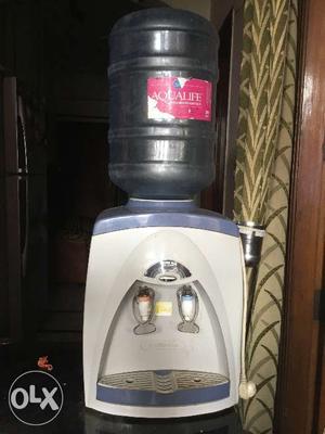 Water dispenser along with two 20 Lts bottle.