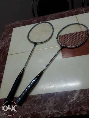 A pair of badminton rackets